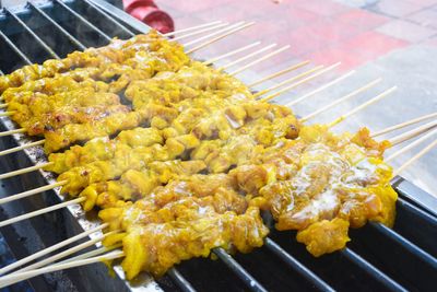 High angle view of meat on barbecue grill