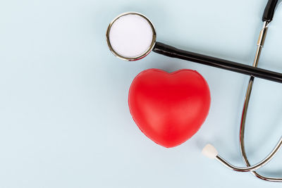 Directly above shot of heart shape over white background