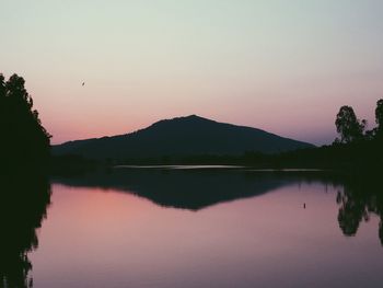 Scenic view of lake with mountains in background