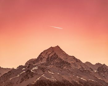 Scenic view of snowcapped mountains against clear sky