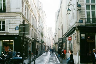 People walking on street in city