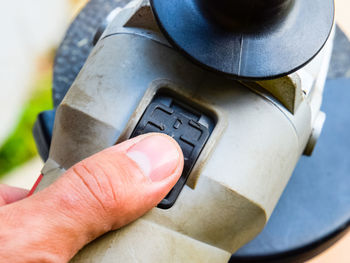 Close-up of hand holding camera