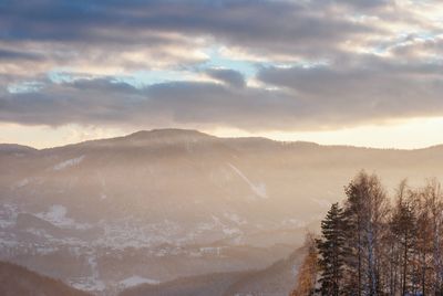 Scenic view of snowcapped mountains against sky