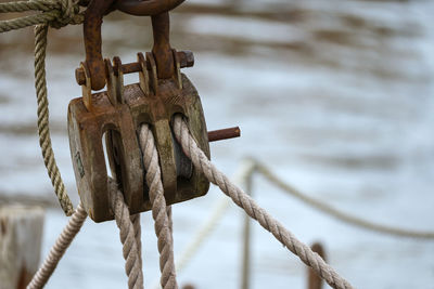 Close-up of rope tied on rusty metal