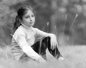 Girl sitting on field