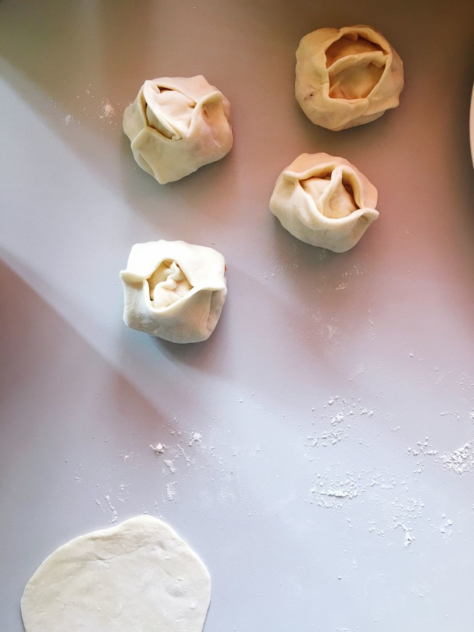 food and drink, freshness, food, indoors, table, still life, sweet food, no people, high angle view, white color, close-up, dessert, preparation, sweet, temptation, indulgence, whipped, dumpling, cream, baked