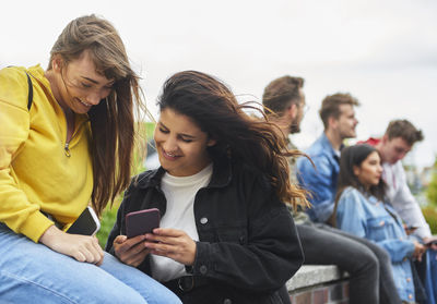 Young woman using smart phone