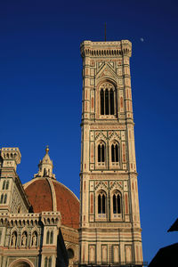 Low angle view of building against blue sky