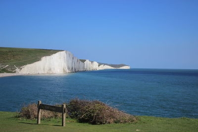 Scenic view of sea against clear blue sky