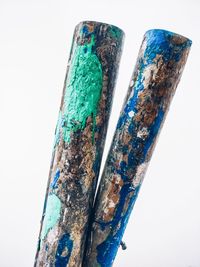 Close-up of rusty over white background