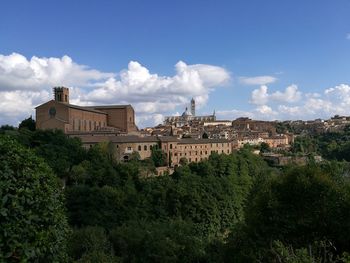 View of town against blue sky