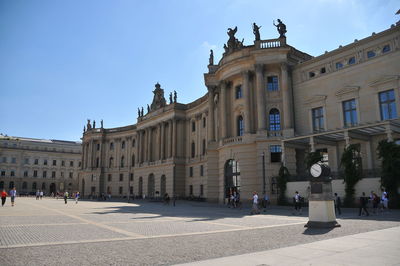 Group of people in front of historical building