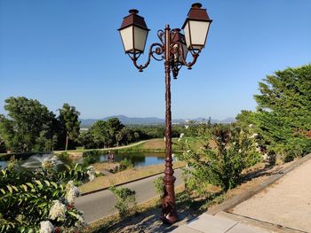Street light against clear blue sky