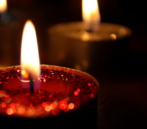 Close-up of lit tea light candle