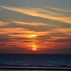 Scenic view of sea at sunset