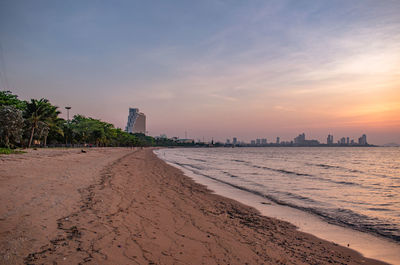 Scenic view of beach against sky during sunset