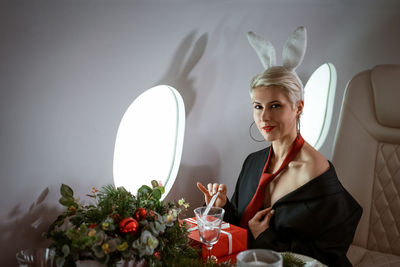 Portrait of sensual woman sitting in airplane