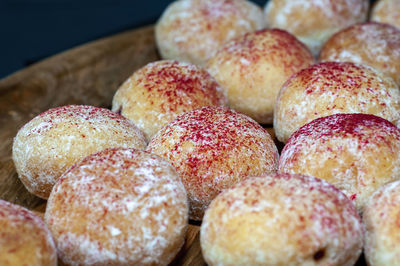 Close-up of jam donuts on table