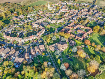 High angle view of trees and buildings in town