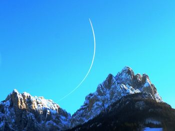 Scenic view of mountains against clear blue sky