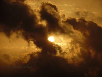 Low angle view of moon at sunset