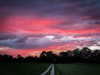 Scenic view of field against sky during sunset