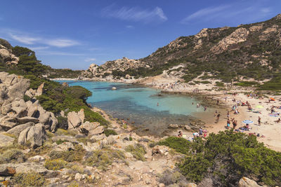 Scenic view of sea and mountains against sky