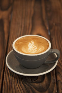 Close-up of cappuccino on table