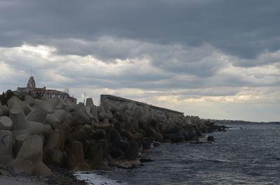 Scenic view of sea against cloudy sky