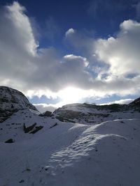 Scenic view of snowcapped mountains against sky