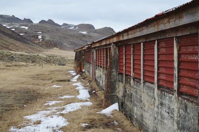 Built structure against mountain range