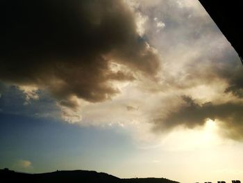 Low angle view of cloudy sky during sunset