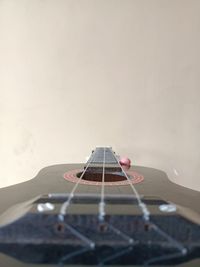 Close-up of person holding guitar