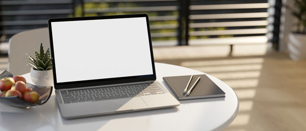 Close-up of laptop on table