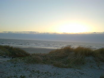 Scenic view of sea at sunset