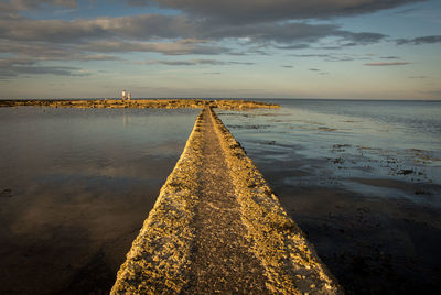 Scenic view of sea against sky at sunset