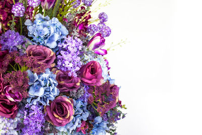 Close-up of rose bouquet against white background