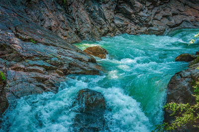 High angle view of rocks in sea