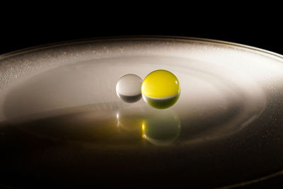 High angle view of yellow and ball on table
