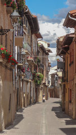 Narrow street amidst buildings in town