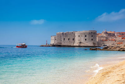 The beautiful banje beach and dubrovnik city