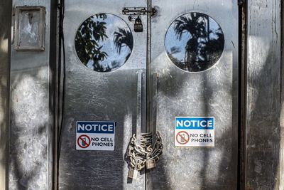 Close-up of text on closed door