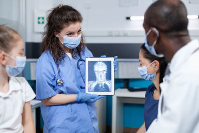 Nurse wearing mask showing medical xray