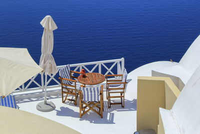 View from a balcony oia village in the caldera by day, greece