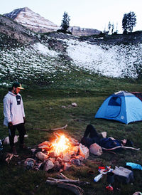 People in tent against bright sun