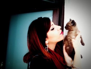 Young woman lying down on sofa at home