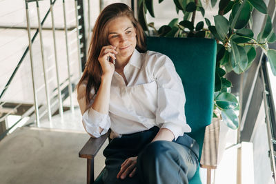 Young woman using mobile phone
