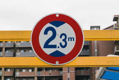 Close-up of road sign against clear sky