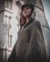 Portrait of young woman standing outdoors