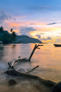 Scenic view of lake against sky during sunset